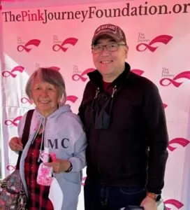 Health fair attendee with her son smiling