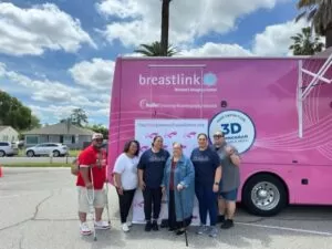 group of women in front of Maddy the mobile mammograph