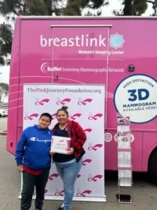 mom and son smiling after free mammogram